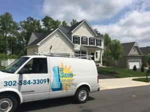 1st State Window Cleaning Van Outside a House