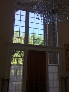 A Dark Room With White Frame Windows
